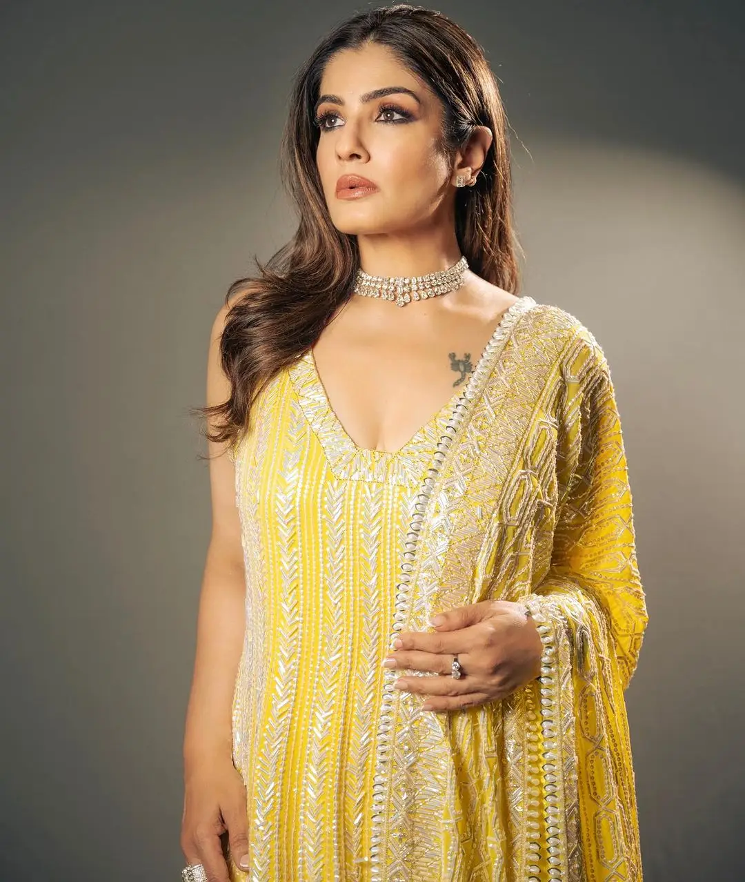 Raveena Tandon Wearing Beautiful Earring Yellow Gown